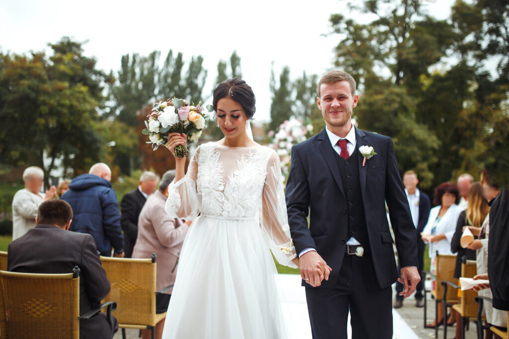 Wedding Trends To Watch In 2024 PortaPixie Events   Happy Groom And Beautiful Bride Wedding Ceremony Under The Arch Decorated With Flowers Wedding Day  1024x683 